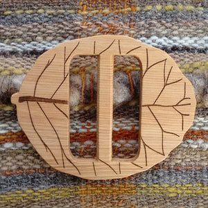 hand carved wooden buttons, buckes and shawl pins