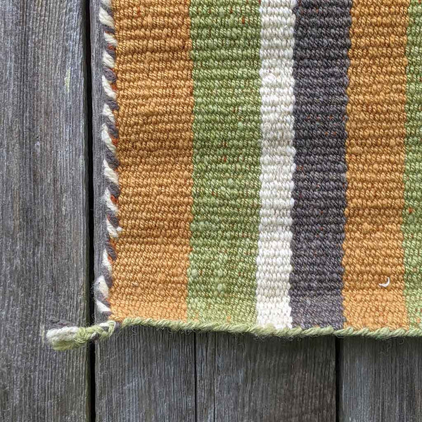 hand woven naturally dyed green stripe rug