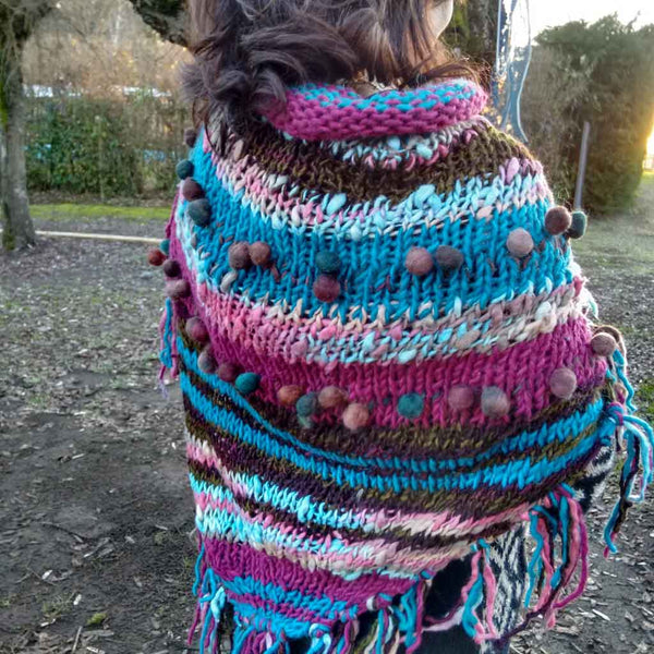 knitted shawl with pompoms