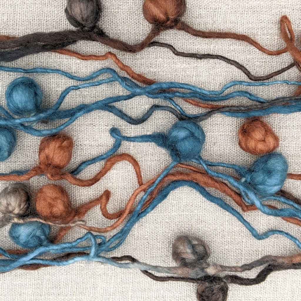 wool art yarn blue and brown tones
